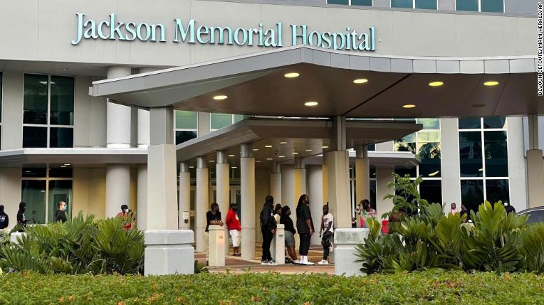 Some of the shooting victims' loved ones wait outside the Ryder Trauma Center at Jackson Memorial Hospital in Miami on Sunday. (Photo: CNN) 