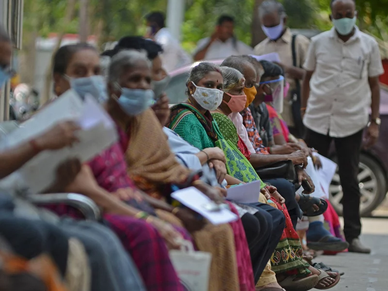 People wait their turn to receive the COVID-19 vaccine at a hospital in Chennai, India, in April. India is among the nations that will receive surplus U.S. vaccine through the international distribution system COVAX, the White House announced. Arun Sankar/AFP via Getty Images