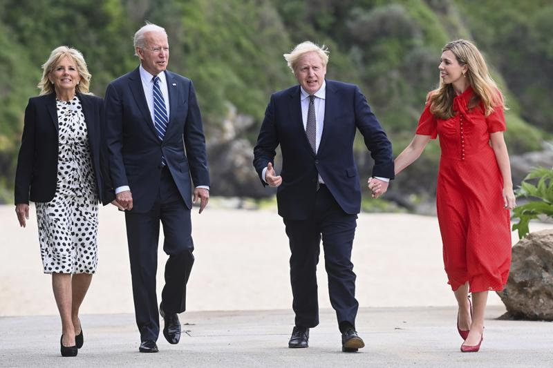 Britain's Prime Minister Boris Johnson, his wife Carrie Johnson and U.S. President Joe Biden with first lady Jill Biden walk outside Carbis Bay Hotel, Carbis Bay, Cornwall, Britain, ahead of the G7 summit, Thursday June 10, 2021. (Toby Melville/Pool Photo via AP)