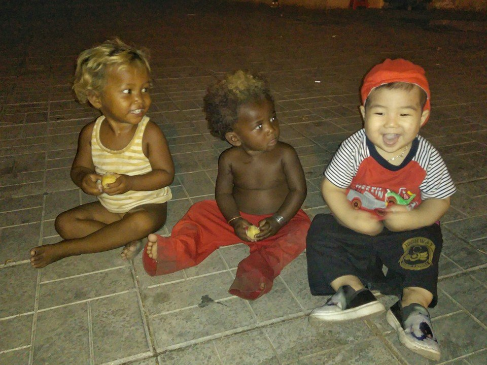 young father takes children backpacking to learn life skills