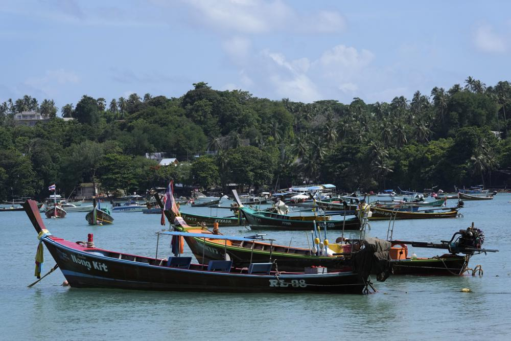 Empty tourist boats sit at anchor at Rawai Beach on Phuket, southern Thailand, Monday, June 28, 2021. Photo: AP 