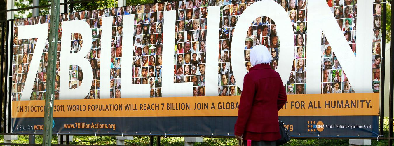 The world's population reached 7 billion on 31 October, 2011. Pictured near an entrance to UN Headquarters is a banner for a global campaign by UNFPAto build awareness of the opportunities and challenges posed by this milestone. UN Photo/Rick Bajornas