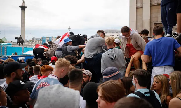 Fans at the security barriers for the fan zone screen in London’s Trafalgar Square. Photograph: Tolga Akmen/AFP/Getty Images