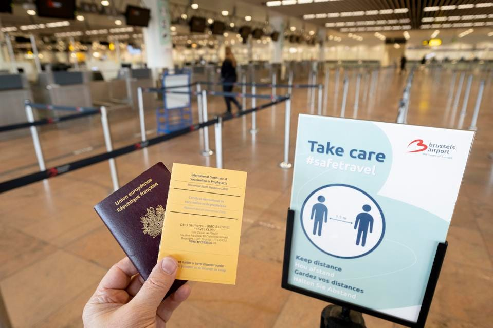 A French passport and an International Certificate of Vaccination. Photo by Thierry Monasse GETTY IMAGES