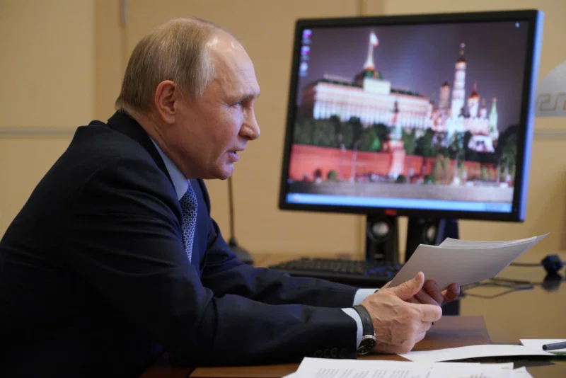 Russias President Vladimir Putin is seen in his office in Novo-Ogaryovo during a video-conference meeting of Russias Council for Interethnic Relations on March 30, 2021. Alexei Druzhinin —TASS via Getty Images