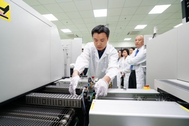 An engineer monitors a production line at a circuit board factory at the Da Nang IT Park. The central city's IZs and IPs have still lured investment in spite of the coronavirus outbreak. (Photo courtesy of Trung Nam Group)