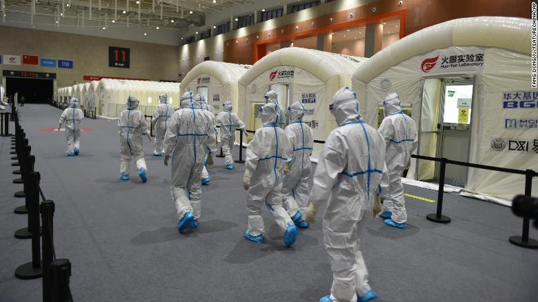 Workers prepare a pop-up Covid-19 testing lab at an expo center in Nanjing, China, on July 28. Photo: CNN