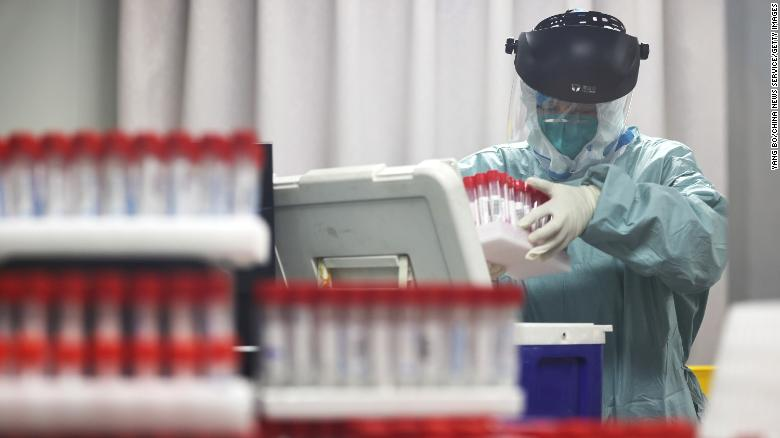 A medical worker works on samples from local residents to be tested for Covid-19 at a laboratory in Nanjing, China, on July 24. Photo: CNN