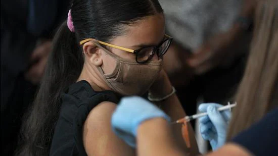 Giret Madina, 14, gets Pfizer’s Covid-19 vaccine at Lehman High School on July 27, 2021, in New York, US. (AP)