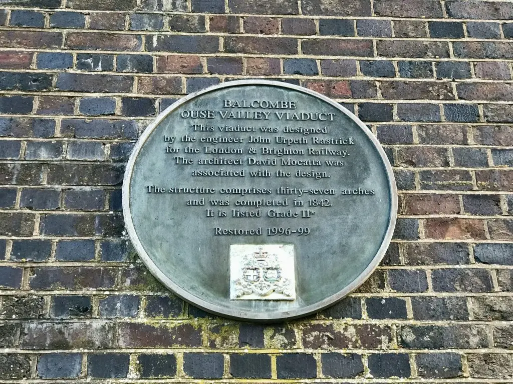 Information about the Viaduct is given on a plaque on one of the brick piers supporting the bridge.  (Image: Martin Burton/SussexLive)