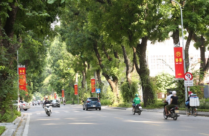 Red flag banners dot the lush green on Hoang Dieu Street in Ba Dinh District. Photo: VOV