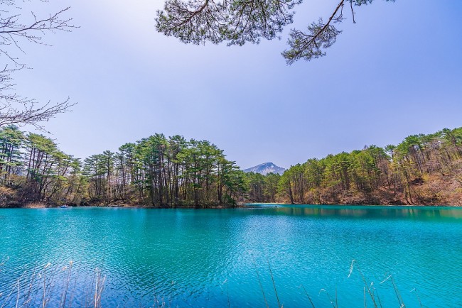 Discover The Beautiful And Mysterious “Five-Coloured Ponds” In Japan