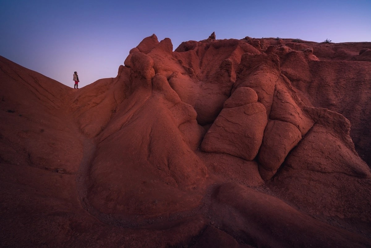 Twilight before the sun comes up. Standing at one of the crazy canyons in Kyrgyzstan that look like they’re coming straight from the moon. Photo: Albert Dros 