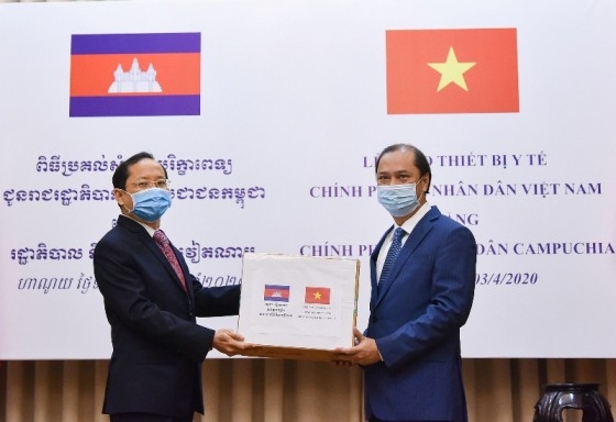 vietnam hands over medical equipment to laos and cambodia for covid 19 combat