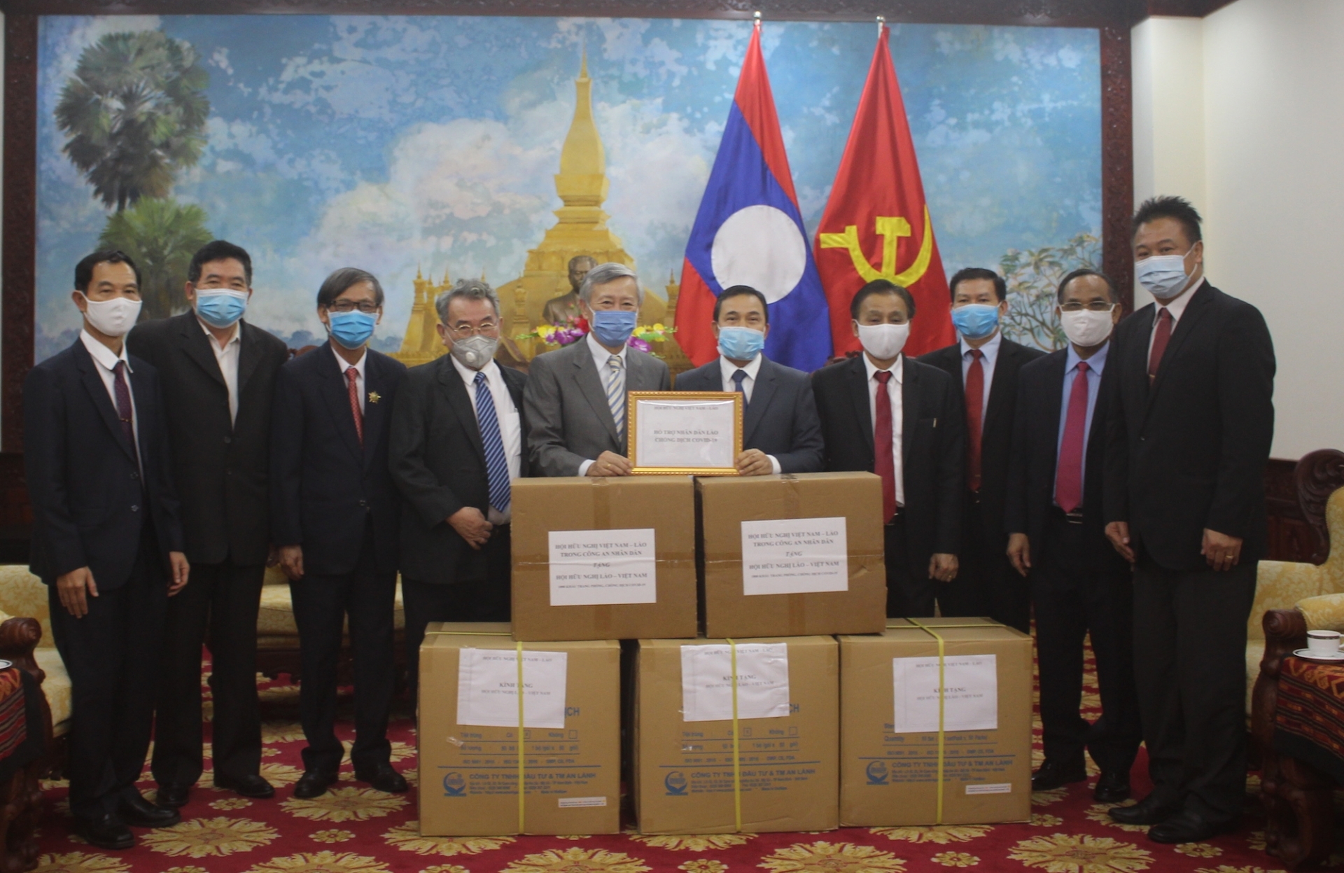 friendship association assists laos covid 19 fight with 500 protective suits 18500 masks