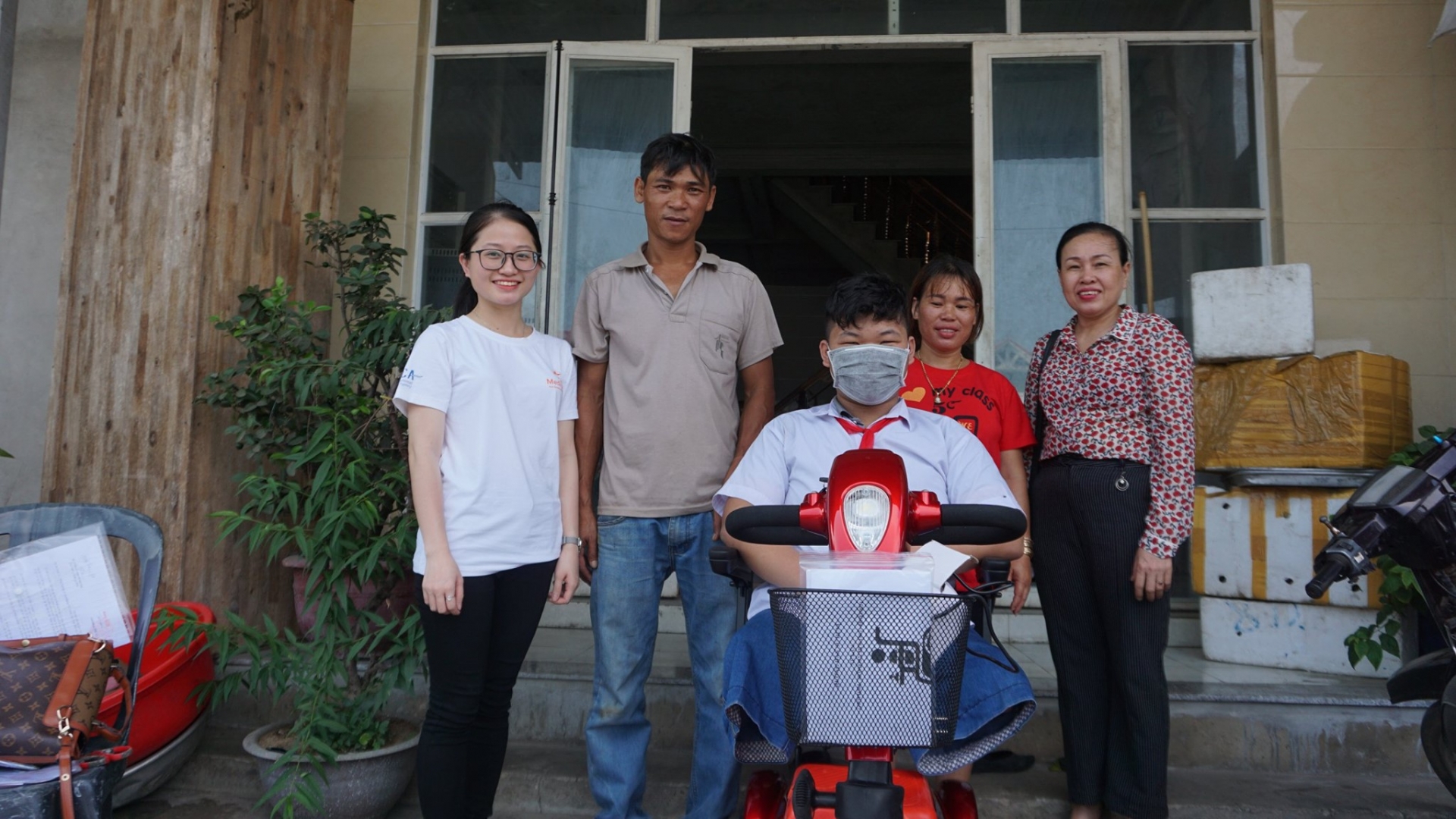 medipeace vietnam presents electric wheelchairs to children in quang tri