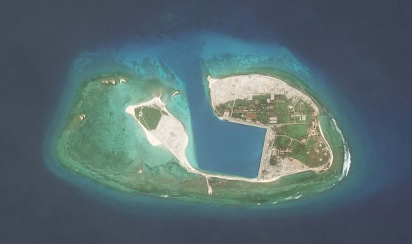 chinese aircraft landing at fiery cross reef vietnam urges parties not to further complicate situation