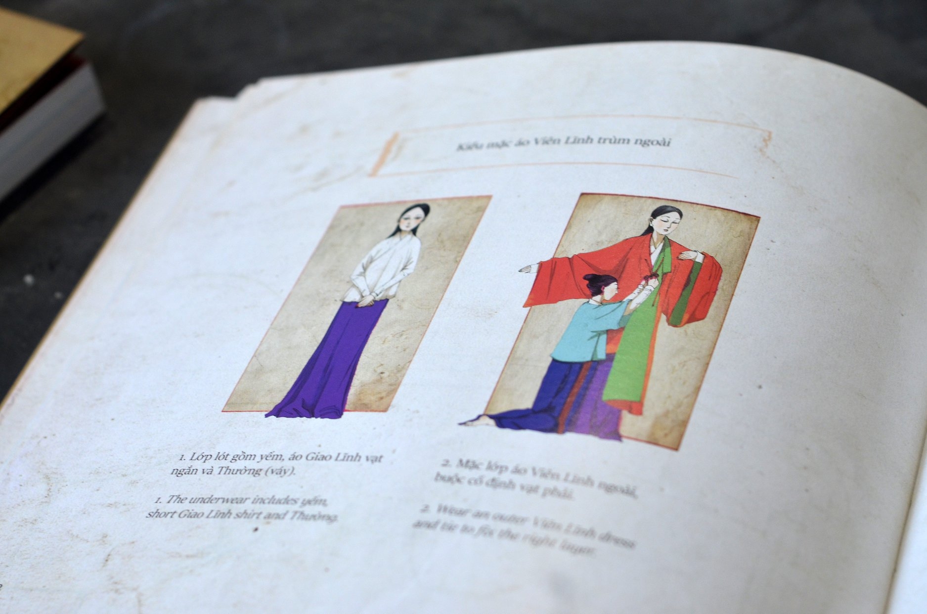weaving a realm bilingual book introduces vietnams costumes from the 15th century