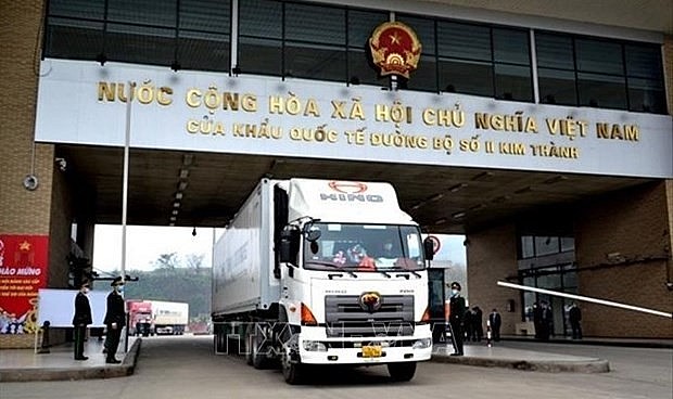A container truck passes through the Hekou-Kim Thanh II International Border Gate. (Photo: VNA)