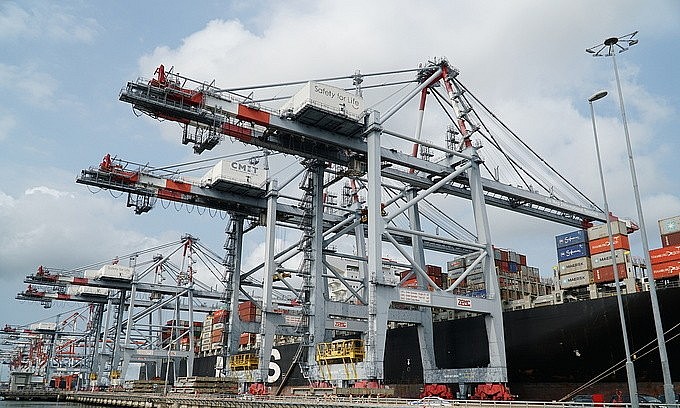 Containers being loaded and unloaded at the Cai Mep-Thi Vai Port in the southern province of Ba Ria Vung Tau, March 30, 2021. Photo by VnExpress/