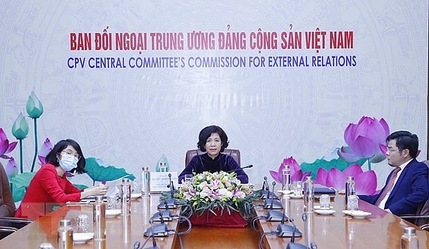 Deputy head of the Party Central Committee's Commission for External Relations Nguyen Thi Hoang Van (middle) at the event