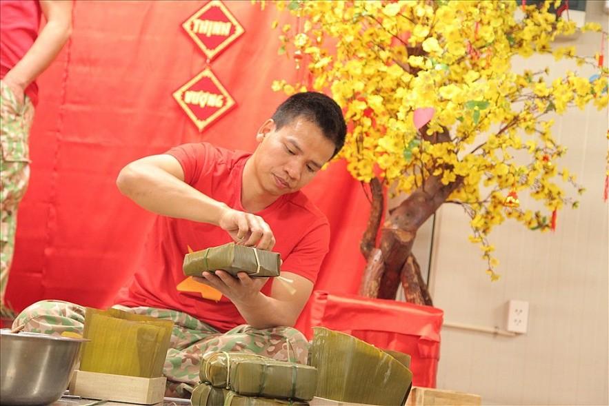 But with careful preparations in advance, Vietnamese officers and employees are still determined to carry out traditional activities to celebrate Tet.