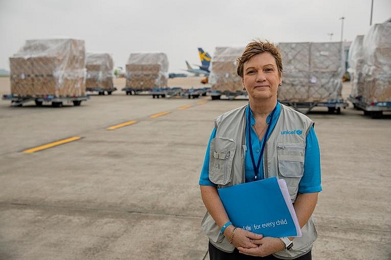 Ms Rana Flower, UNICEF Representative in Viet Nam stands in front of the first shipment of 811,200 doses of COVID-19 Vaccine supported by COVAX on 1st Apr 2021 at the Noi Bai International Airport.