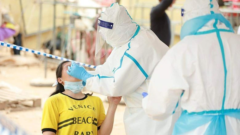 A woman has her sample taken for Covid-19 testing in Phnom Penh. - Phnom Penh Post/ANN