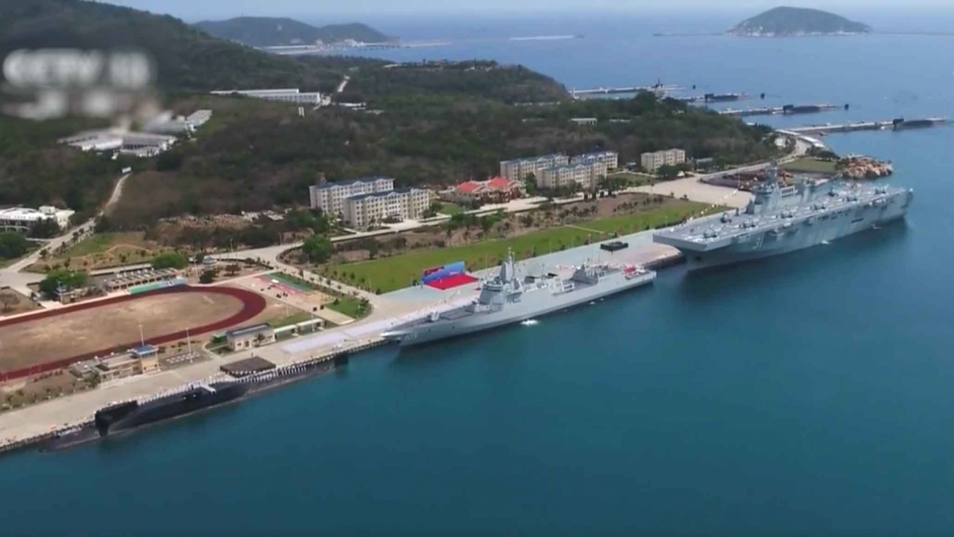 Warships on display at a naval port in Hainan Province, China, April 23, 2021. /Screenshot from CMG