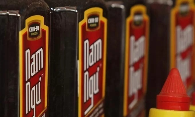 Masan Group's Nam Ngu brand fish sauce displayed for sale at a market in Hanoi. Photo by Reuters.