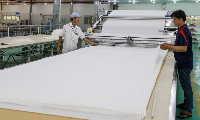 Workers at a textile factory in Vietnam's southern province of Long An, February 2020. Textile is on the list of industries expected to benefit from the new free trade deal between Vietnam and the U.K. Photo by VnExpress/Quynh Tran.