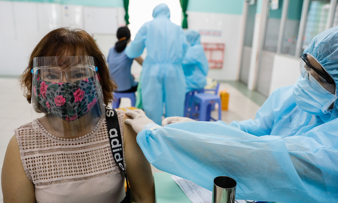 A woman receives a Covid-19 vaccine shot in HCMC, June 21, 2021. Photo by VnExpress/Huu Khoa.