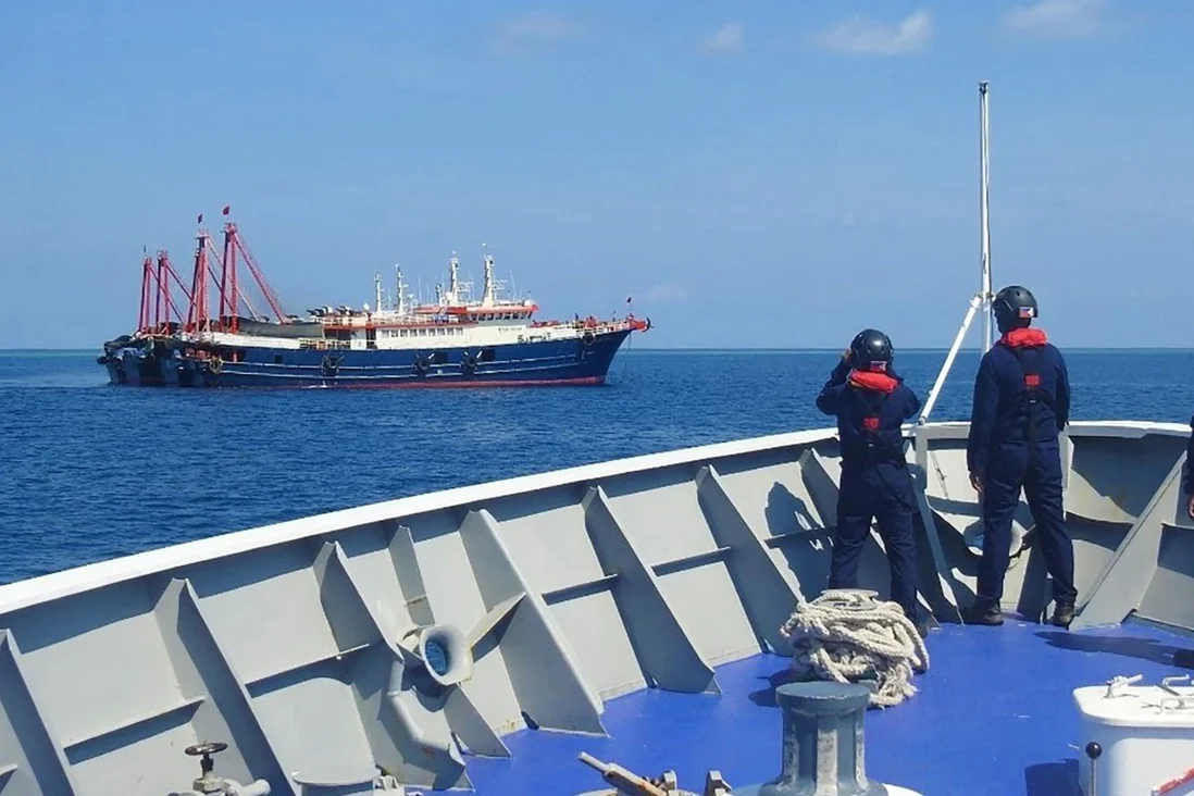 Philippine coastguard personnel aboard the BRP Cabra monitor Chinese vessels anchored at Sabina Shoal, a South China Sea outcrop claimed by both Manila and Beijing. Photo: AFP