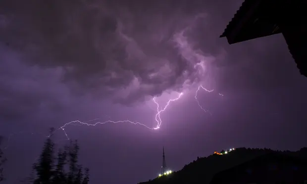 A thunderstorm in Srinagar, India, last week. The Indian meteorological department has warned of more lightning in the next few days. Photograph: Saqib Majeed/SOPA Images/Rex/Shutterstock
