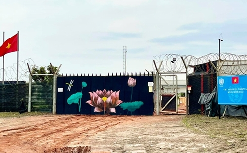 The hospital’s main gate with lotus flowers