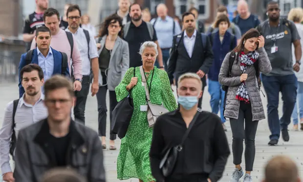 Commuters on London Bridge. Prof Sir Andrew Pollard, director of the Oxford Vaccine Group, said: ‘The Delta variant will still infect people who have been vaccinated.’ Photograph: Guy Bell/REX/Shutterstock