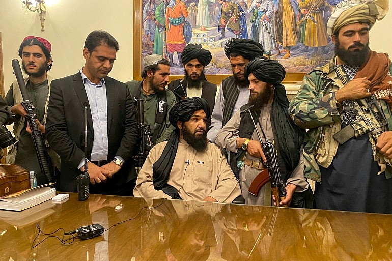 Taliban fighters take control of Afghan presidential palace after the Afghan President Ashraf Ghani fled the country, in Kabul, Afghanistan, Sunday, Aug. 15, 2021 [Zabi Karimi/ AP]