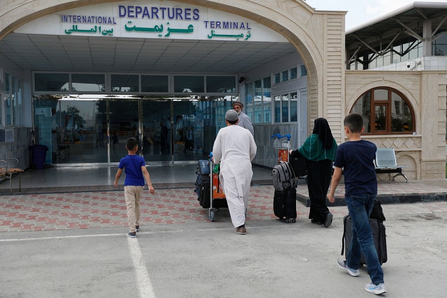 Passengers enter the departures terminal of Hamid Karzai International Airport, in Kabul, Afghanistan, on August 14. Rahmat Gul/AP