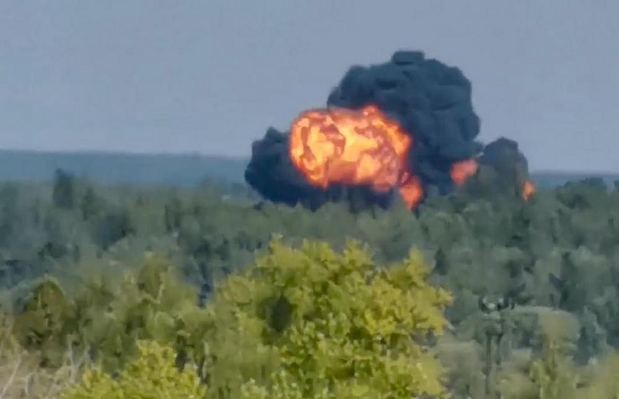 n this handout photo taken from video provided by Dmitry Ovchinnikov, flame and smoke rise from the place where the new light military transport plane Il-112V crashes near Kubinka airfield about 45 kilometers (28 miles) west of Moscow, Russia, Tuesday, Aug. 17, 2021. The prototype military transport plane crashed while performing a test flight outside Moscow on Tuesday, Russian news agencies reported, citing Russia's United Aircraft Corporation. The new light military transport plane, Il-112V, crashed in a forested area as it was coming in for a landing at the Kubinka airfield about 45 kilometers (28 miles) west of Moscow, spokespeople of the corporation told the Tass news agency. (Dmitry Ovchinnikov via AP)