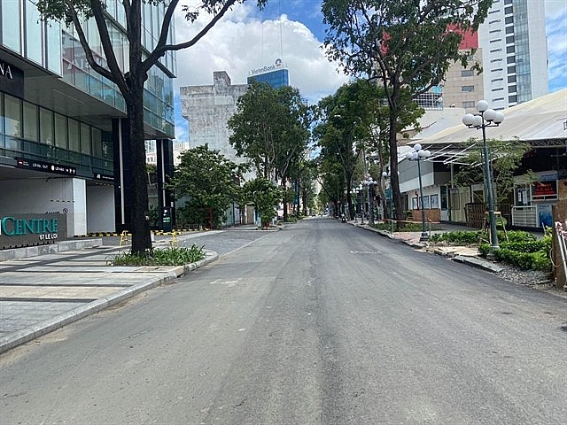 Nam Kỳ Khởi Nghĩa Street is deserted even before 6pm on July 26. VNA/VNS.Photo Mạnh Linh- Hoàng Tuyết