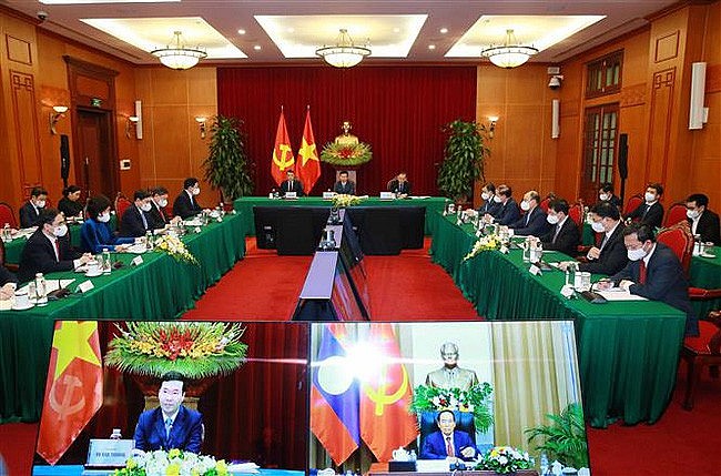 Vietnam, Laos Share Party Building Experience