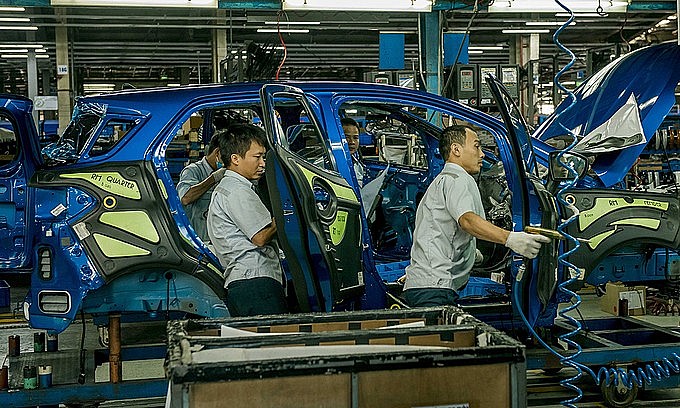 Workers assemble cars in a factory of Ford in the northern province of Hai Duong. Photo courtesy of Ford Vietnam.