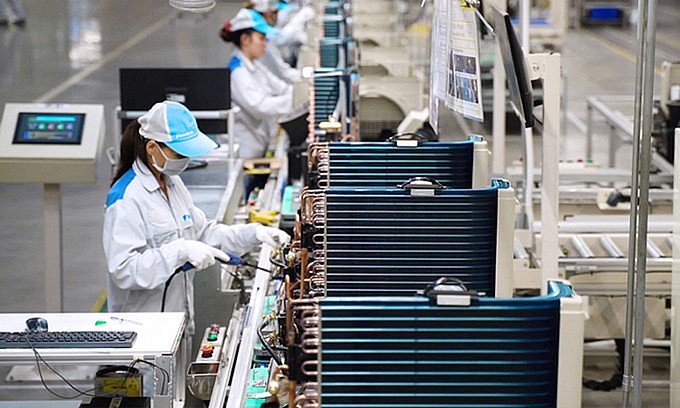 Workers at an air conditioner making factory in northern Hung Yen Province. Photo by VnExpress/Vien Thong.