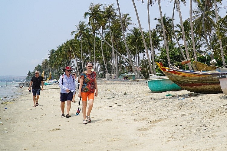 Foreigners are at beach in Mui Ne, Binh Thuan Province, March 2020. Photo by VnExpress