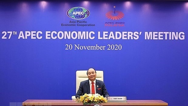 Then Prime Minister Nguyen Xuan Phuc attends the 27th APEC Economic Leaders’ Meeting via videoconference on November 20, 2020 (Photo: VNA)