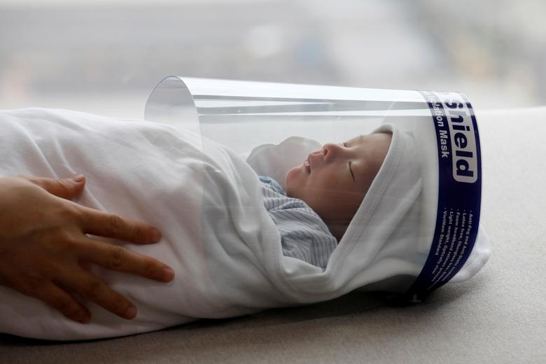 reuters features vietnamese newborn face shield in its pictures of the year