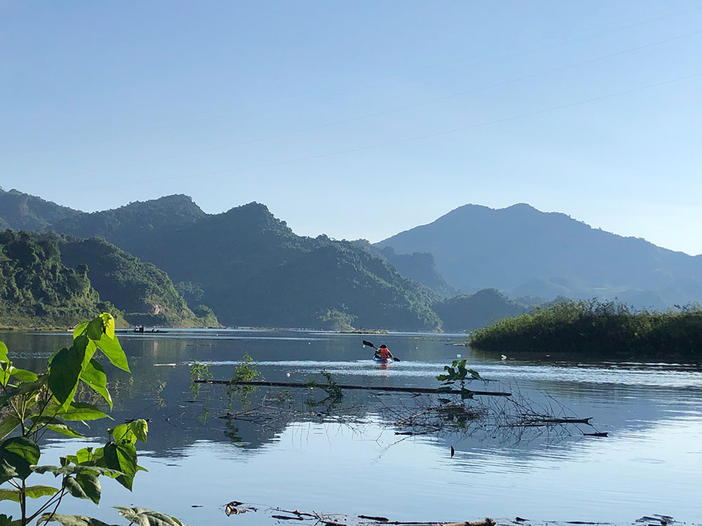 kayaking on mountains lake