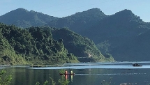kayaking on mountains lake