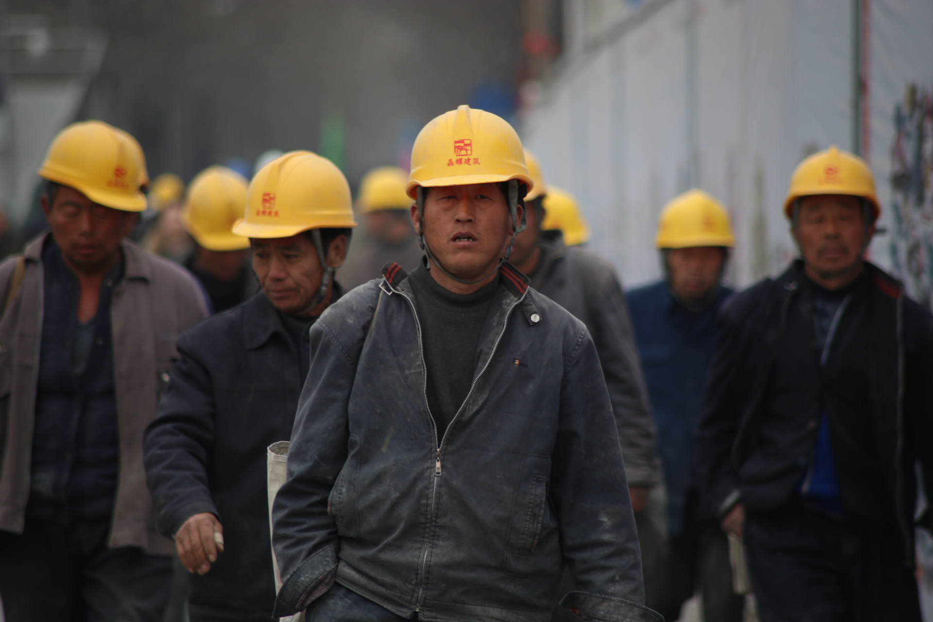 2432 group of persons wearing yellow safety helmet during daytime 33266