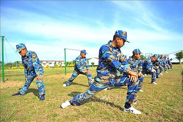 Vietnamese naval troops trained hard on land to cope with dangers at sea